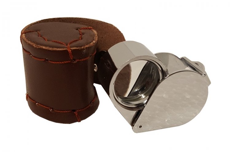 Leather case including 10x magnifying glass